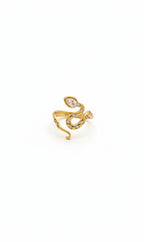 A gold snake-shaped ring with small clear gemstones, photographed on a plain white background.
Grishita Jewellery