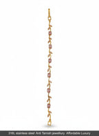 A delicate gold-toned vine bracelet featuring small pink gemstone accents, displayed vertically against a plain white background with a black text banner at the bottom.
Grishita Jewellery
