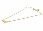 A delicate gold chain necklace featuring a rectangular nameplate pendant engraved with the name 'ELI', displayed on a clean white background.
Grishita Jewellery