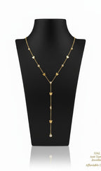 A gold lariat-style necklace with small butterfly motifs and a central drop ending in a pearl-like bead, displayed on a black jewelry bust against a white background.
Grishita Jewellery